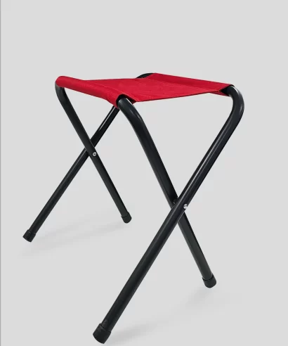 Portable outdoor folding stool used while camping