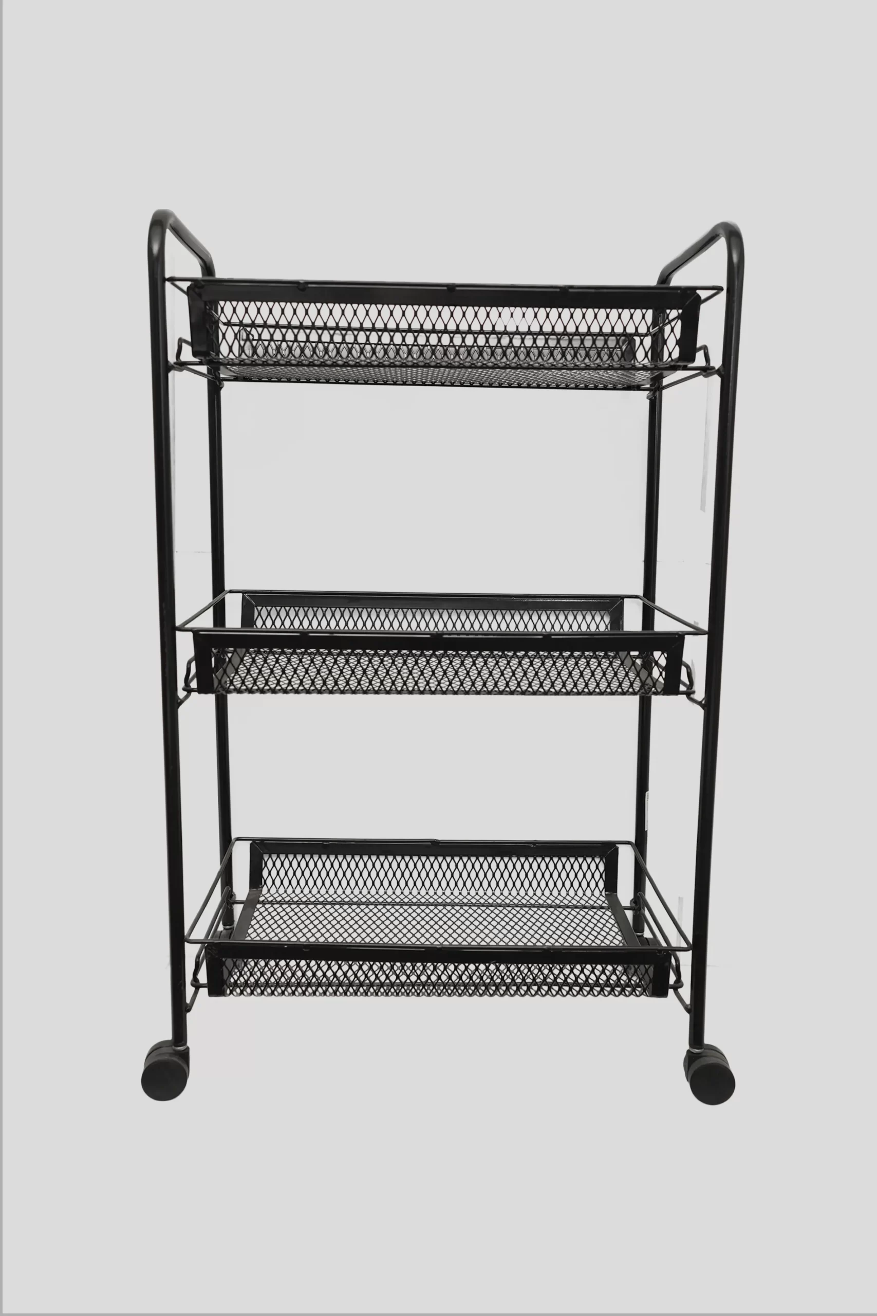 Rolling storage trolley with mesh shelves in home setting Rolling storage trolley with mesh shelves in home setting